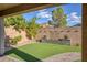 Artificial turf backyard with brick pavers and sitting area at 25 Via Corvina, Henderson, NV 89011
