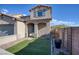 Two-story house with a well-manicured front yard, featuring brick pathways and lush green grass at 25 Via Corvina, Henderson, NV 89011