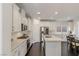 Modern kitchen with white cabinets and stainless steel appliances at 25 Via Corvina, Henderson, NV 89011