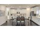 Bright kitchen with white cabinets and dark hardwood floors at 25 Via Corvina, Henderson, NV 89011