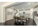 Open concept kitchen with white cabinets and island at 25 Via Corvina, Henderson, NV 89011