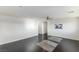 Spacious loft area with dark hardwood floors and ceiling fan at 25 Via Corvina, Henderson, NV 89011