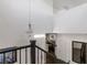 Open staircase with modern railing overlooking the living room at 25 Via Corvina, Henderson, NV 89011