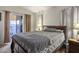 Bedroom with sliding glass door to backyard and neutral decor at 2594 Florida Keys Dr, Las Vegas, NV 89156