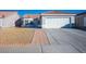 House exterior with a two car garage and walkway at 2594 Florida Keys Dr, Las Vegas, NV 89156