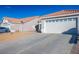 House exterior with a two car garage and driveway at 2594 Florida Keys Dr, Las Vegas, NV 89156