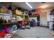 Partially organized garage with various storage solutions at 2594 Florida Keys Dr, Las Vegas, NV 89156