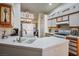 Kitchen boasts white tile countertops, stainless steel appliances, and ample cabinetry at 2594 Florida Keys Dr, Las Vegas, NV 89156