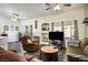 Living room featuring a fireplace, flat-screen TV, and comfortable seating at 2594 Florida Keys Dr, Las Vegas, NV 89156