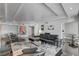 Spacious living room featuring a sleek black leather sectional sofa and modern decor at 2877 Paradise Rd # 1004, Las Vegas, NV 89109