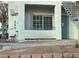 Building exterior featuring a teal door, stairs, and a window at 3318 N Decatur Blvd # 1073, Las Vegas, NV 89130