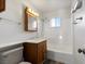 Clean bathroom with a tub, shower, and wood vanity at 350 E Desert Inn Rd # H208, Las Vegas, NV 89109