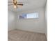 Cozy carpeted bedroom with a ceiling fan and window at 350 E Desert Inn Rd # H208, Las Vegas, NV 89109