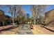 Landscaped courtyard with a park bench and trees at 350 E Desert Inn Rd # H208, Las Vegas, NV 89109