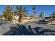 Building exterior showing parking and landscaping at 350 E Desert Inn Rd # H208, Las Vegas, NV 89109