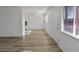 Spacious living room featuring wood-look floors and lots of natural light at 350 E Desert Inn Rd # H208, Las Vegas, NV 89109