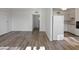 Bright living room with hardwood floors and access to other rooms at 350 E Desert Inn Rd # H208, Las Vegas, NV 89109