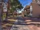 Apartment building with a grassy area and walkways at 350 E Desert Inn Rd # H208, Las Vegas, NV 89109