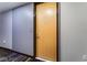 Light wood door and striped carpet in apartment entryway at 353 E Bonneville Ave # 711, Las Vegas, NV 89101