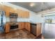 Modern kitchen with stainless steel appliances and wood cabinets at 353 E Bonneville Ave # 711, Las Vegas, NV 89101