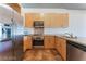 Modern kitchen with stainless steel appliances and wood cabinets at 353 E Bonneville Ave # 711, Las Vegas, NV 89101