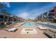 Community pool with fire pit and lounge chairs at 353 E Bonneville Ave # 711, Las Vegas, NV 89101