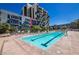 Resort-style pool with lounge chairs and steps at 353 E Bonneville Ave # 711, Las Vegas, NV 89101