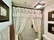 Clean bathroom with lace curtains and a bathtub at 3550 Bay Sands Dr # 1070, Laughlin, NV 89029