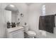 Clean bathroom with white vanity and round mirror at 4071 Village Sq, Las Vegas, NV 89121