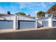 Attached garages with light blue doors at 4071 Village Sq, Las Vegas, NV 89121