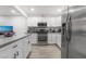 Modern kitchen with stainless steel appliances at 4071 Village Sq, Las Vegas, NV 89121