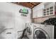 Laundry room with washer, dryer, and cabinets at 4071 Village Sq, Las Vegas, NV 89121