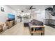 Open concept living room with kitchen and stairs at 4071 Village Sq, Las Vegas, NV 89121