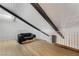 Spacious loft area with a comfortable chair and wood flooring at 4071 Village Sq, Las Vegas, NV 89121
