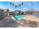 Inviting community pool with surrounding lounge chairs and palm trees at 4071 Village Sq, Las Vegas, NV 89121