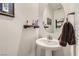 Clean and modern bathroom with pedestal sink and oval mirror at 495 Granite Arch St, Las Vegas, NV 89138