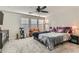 Spacious bedroom with large windows and ceiling fan at 495 Granite Arch St, Las Vegas, NV 89138