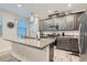 Modern kitchen with stainless steel appliances and an island at 495 Granite Arch St, Las Vegas, NV 89138