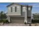 Two-story house with gray siding, shutters, and a two-car garage at 6592 Tumoulin St, Las Vegas, NV 89148