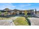 Landscaped backyard with patio, walkways, and outdoor kitchen at 7036 Winstar St # A, Las Vegas, NV 89131