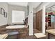 Spa-like bathroom featuring a large soaking tub and a separate shower at 7036 Winstar St # A, Las Vegas, NV 89131