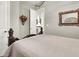 Cozy bedroom with a queen-size bed and access to a hallway at 7036 Winstar St # A, Las Vegas, NV 89131