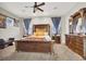 Luxurious Primary bedroom with a king-size bed and stylish furniture at 7036 Winstar St # A, Las Vegas, NV 89131