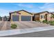 Three-car garage and gated driveway leading to a lovely single story house at 7036 Winstar St # A, Las Vegas, NV 89131