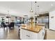 Open concept kitchen with large island and stainless steel appliances at 7036 Winstar St # A, Las Vegas, NV 89131
