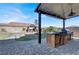Rustic outdoor kitchen with built-in grill and paver patio at 7036 Winstar St # A, Las Vegas, NV 89131