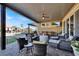 Relaxing covered patio with wicker furniture and ceiling fan at 7036 Winstar St # A, Las Vegas, NV 89131