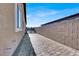 Side yard with brick pavers and a block wall at 7036 Winstar St # A, Las Vegas, NV 89131