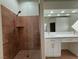 Bathroom with a large walk-in shower, double vanity, and modern fixtures at 8545 Summer Vista Ave, Las Vegas, NV 89145