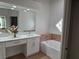 Bathroom boasts a large soaking tub, double vanity, and updated fixtures at 8545 Summer Vista Ave, Las Vegas, NV 89145